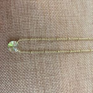 Gold “unicorn” stone necklace